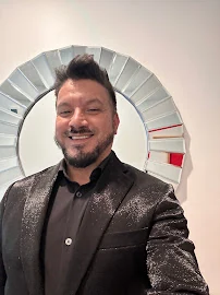 Portrait of Carlos Flores, Salon Owner and Master Stylist at Aqua Aveda Salon & Spa